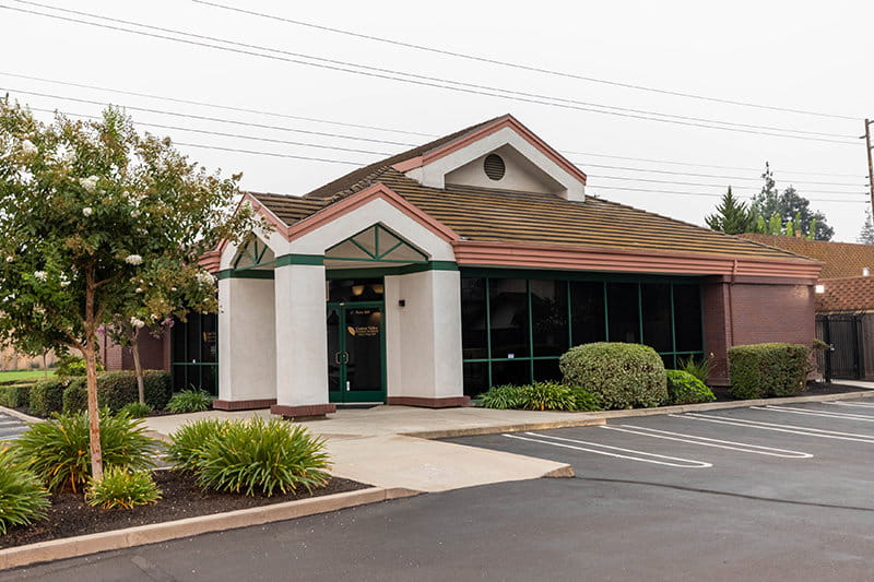 Side-view of dental building and parking lot